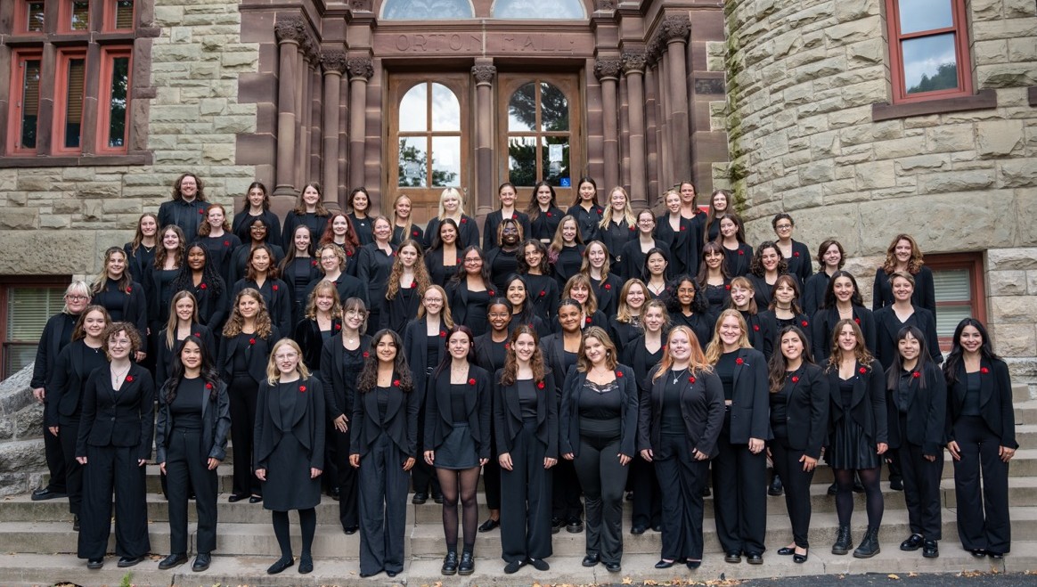 Members of Women's Glee pose for group photo outside of Orton Hall
