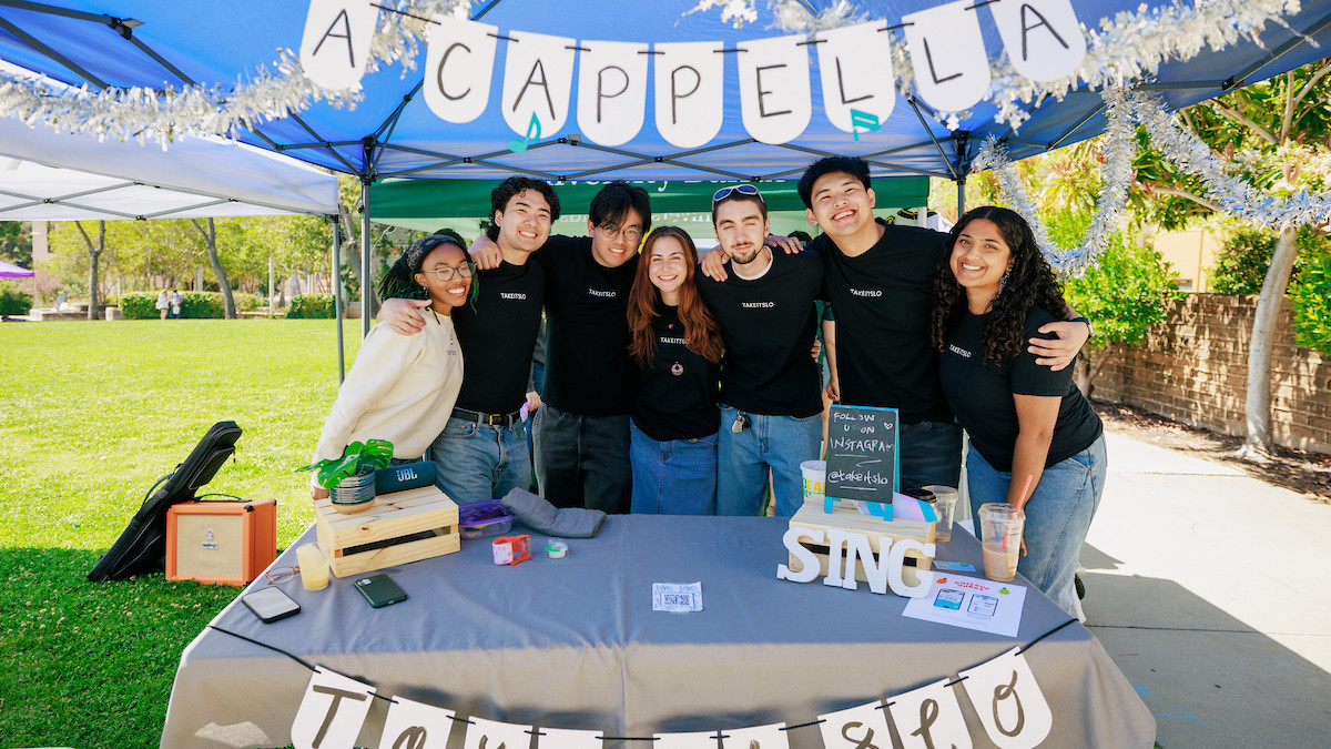 Group of students promoting their acappella booth