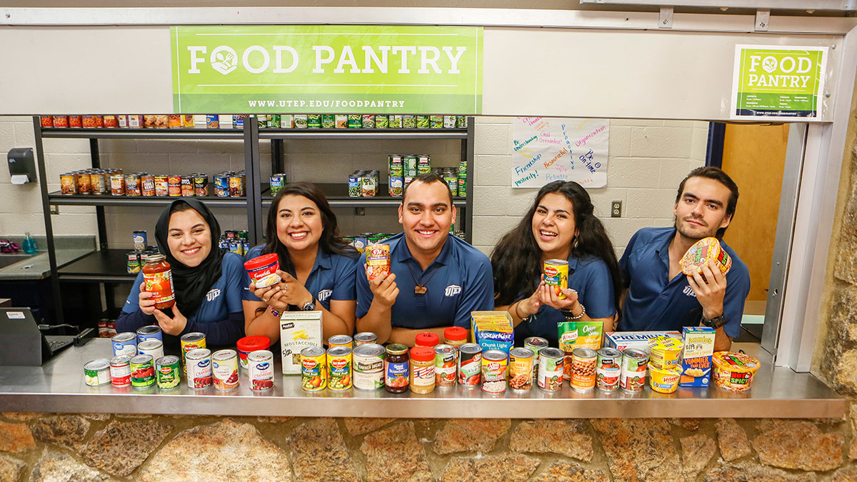 Students staffing food pantry window