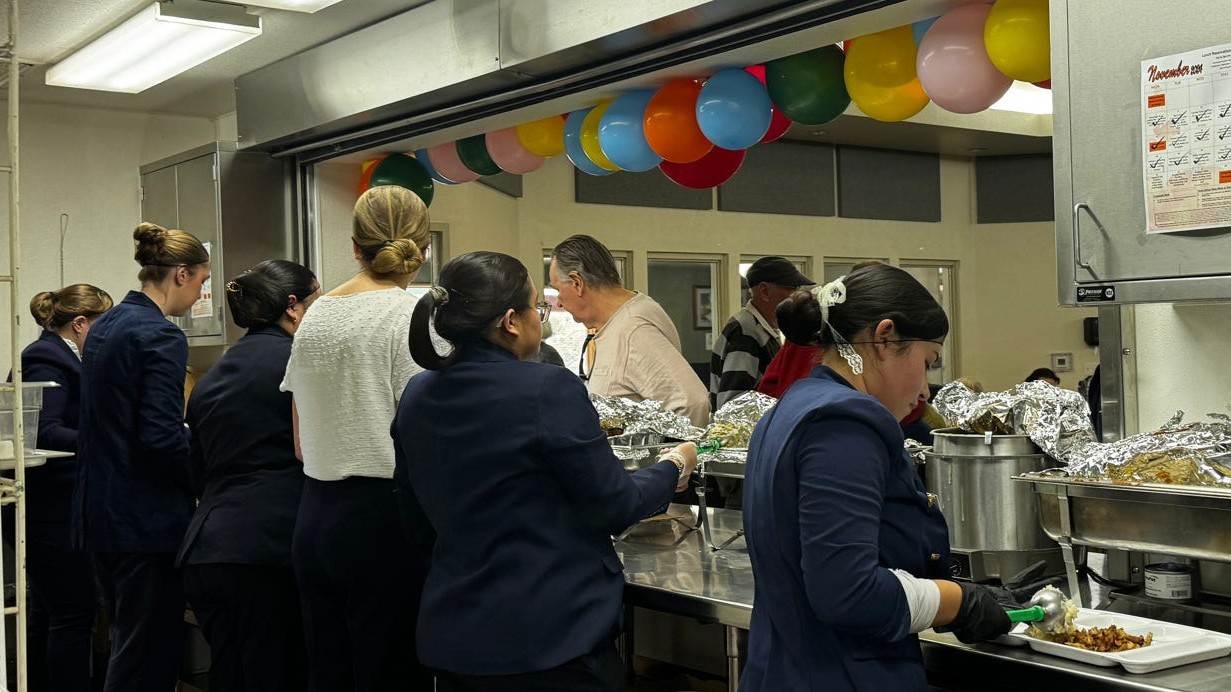 Serving dozens of Thanksgiving meals cooked by the Kayettes