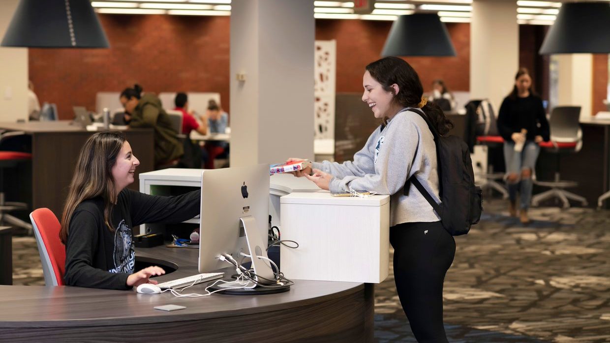 Cowles Library returning book