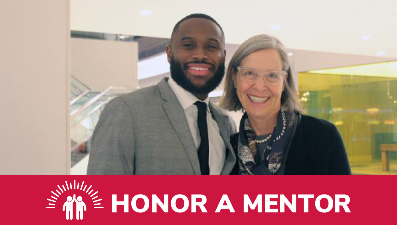 Student and mentor smiling for a photo