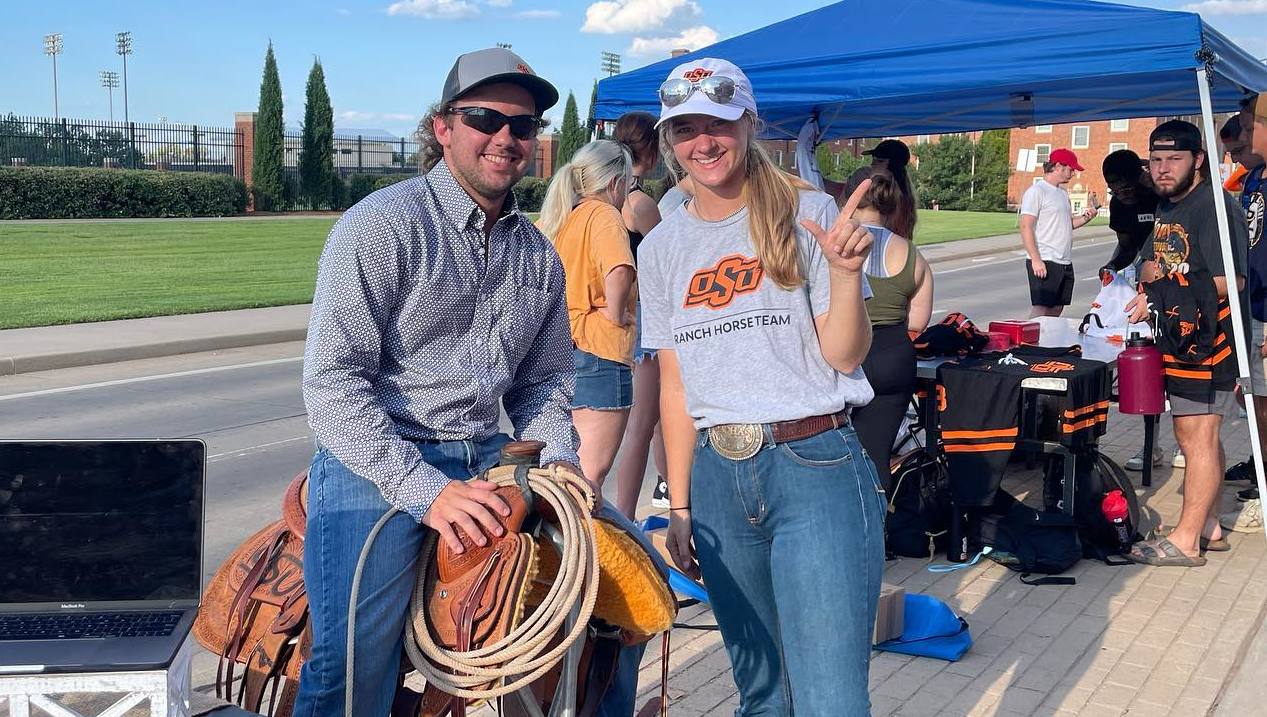 Team members recruiting for the team at OSU Lights on Stillwater.