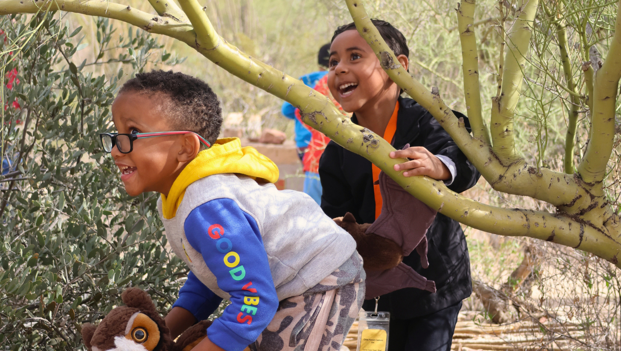 PreK Students Playing in the Nature Play Space