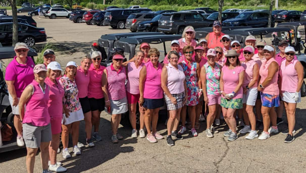 Five golfers standing in a parking lot for the Stefanie Spielman Fund for breast cancer research