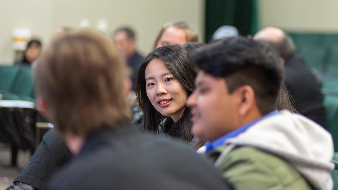 3 Young professionals enthralled within a discussion.
