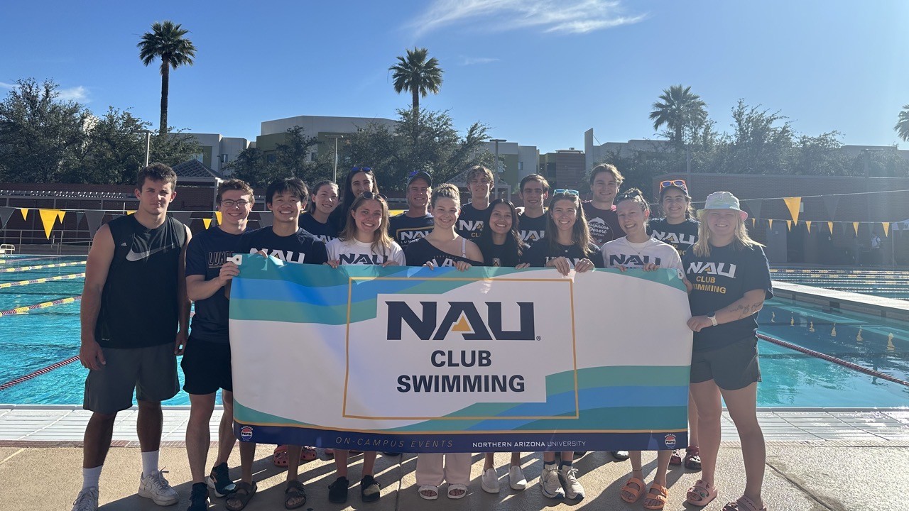 The NAU swimming club members, holding their club flag