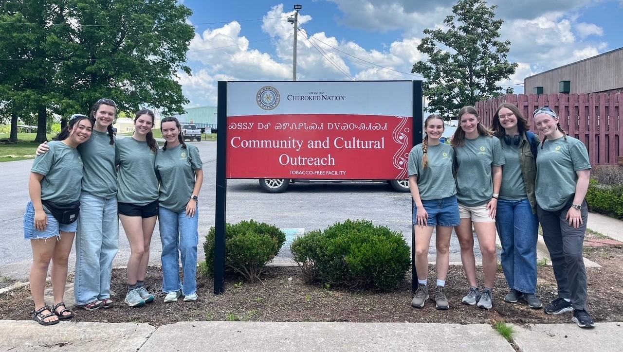 Buck-I-Serv group posing with sign