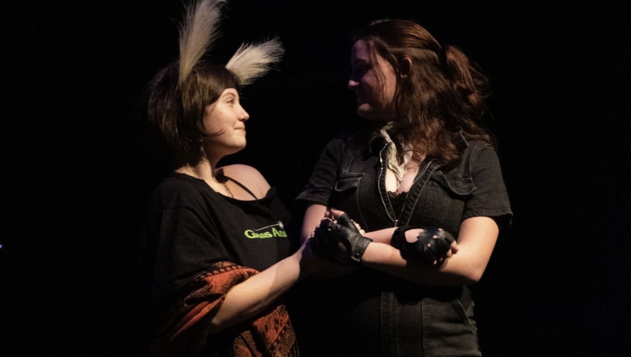 Shows two actors in a 10-minute play apart of the 24 hour theatre event