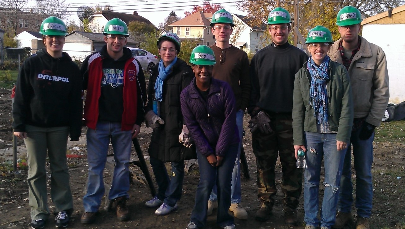 Student giving a presentation inside a classroom.