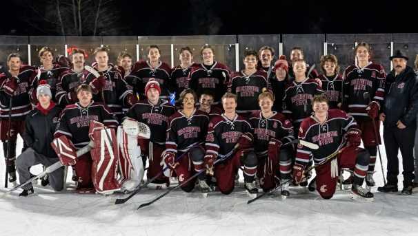 WSU Men’s Ice Hockey team posing on an outdoor rink during the Winter Classic in Winthrop.