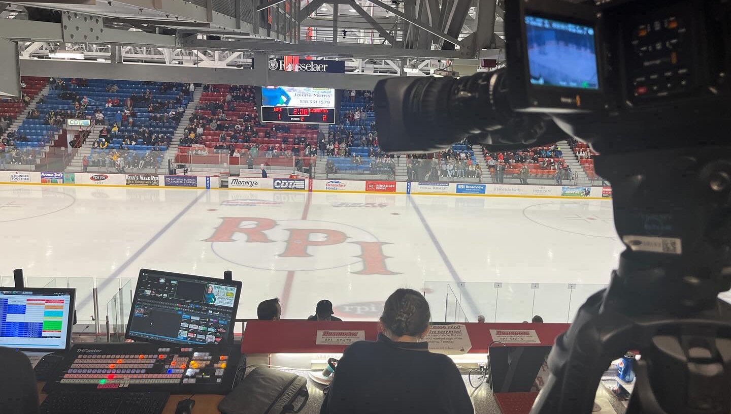 In the booth looking out onto the ice at the Houston Field House.