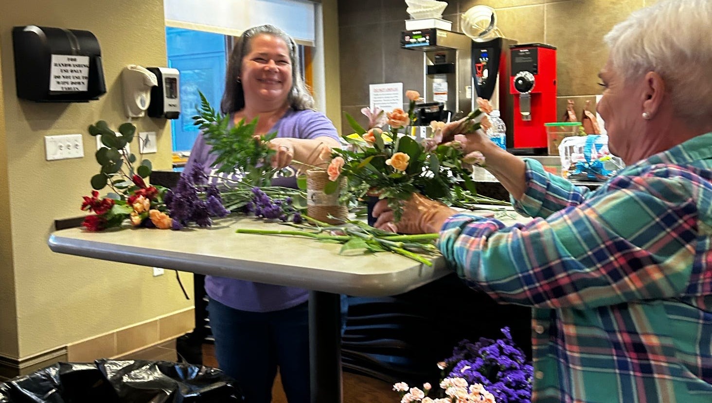 Fred's Flowers teaching NACE about floral arrangements