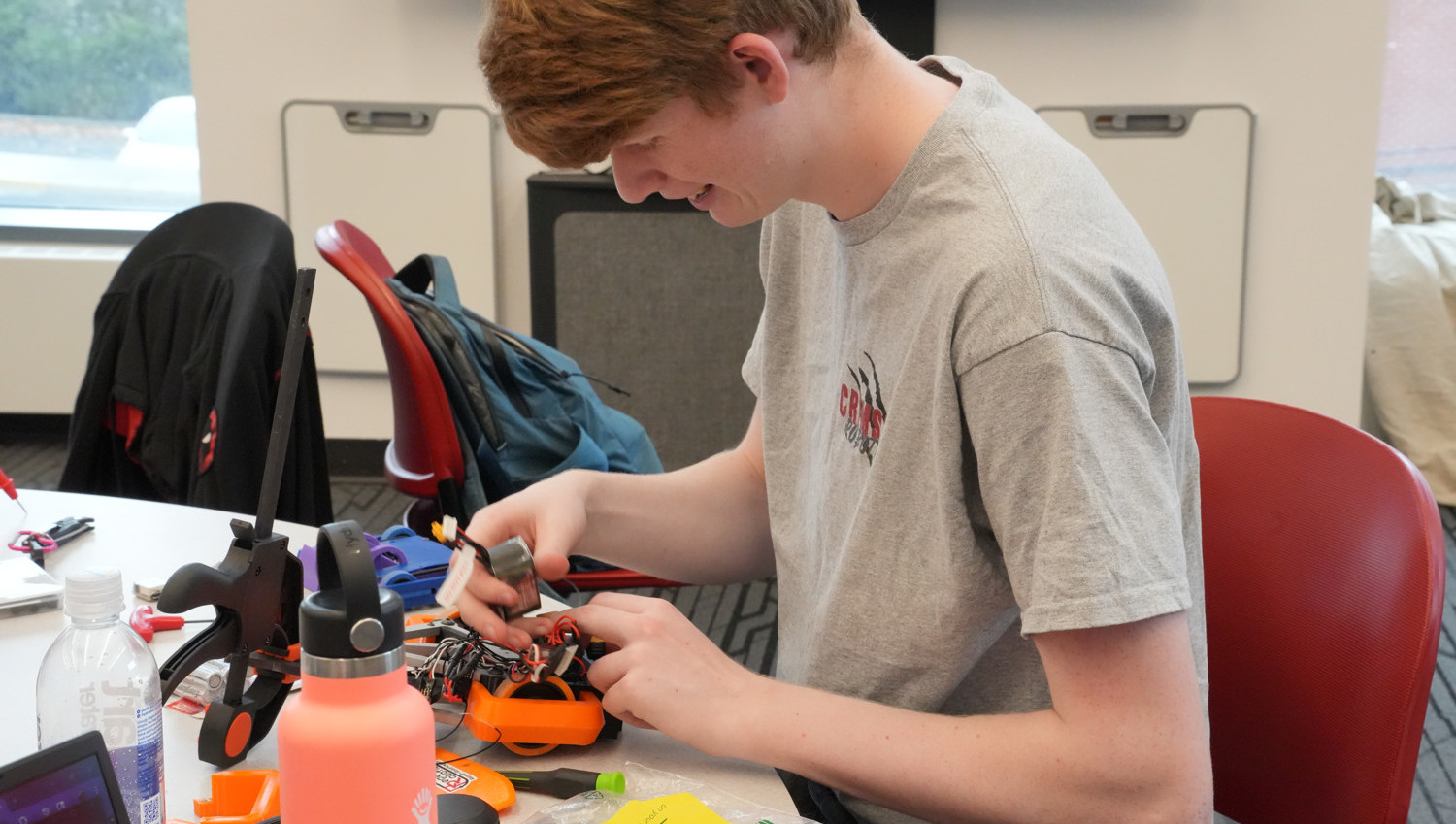 Club member working on bot during the Fall 2025 Crimson Bot Brawl