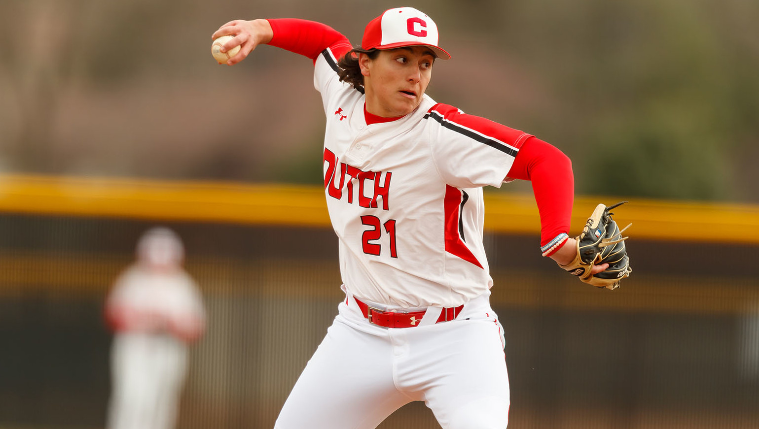 Junior, Marcus Wenzel pitches in the game against Wartburg.