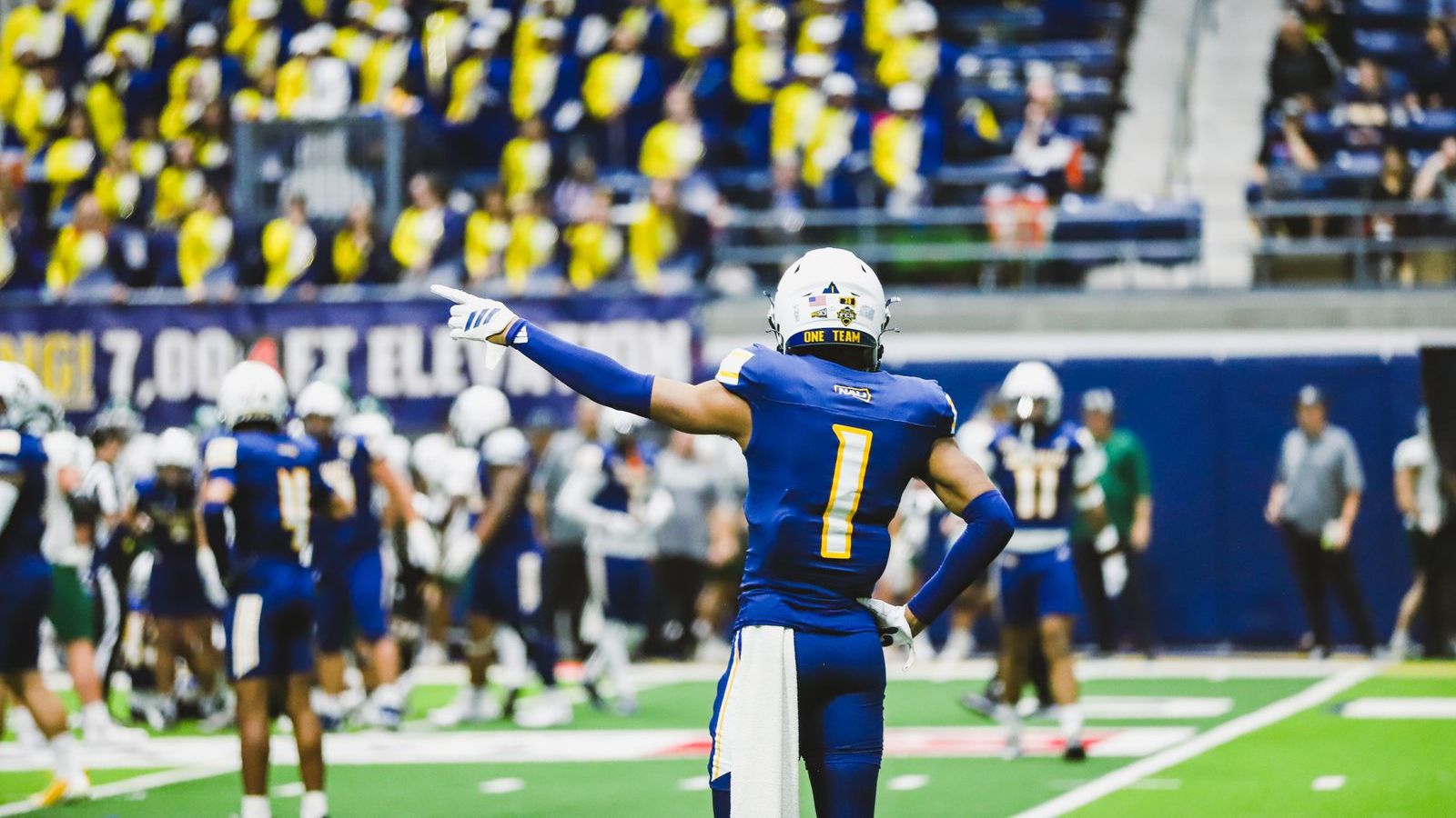 Football player on the field during the HOCO game.
