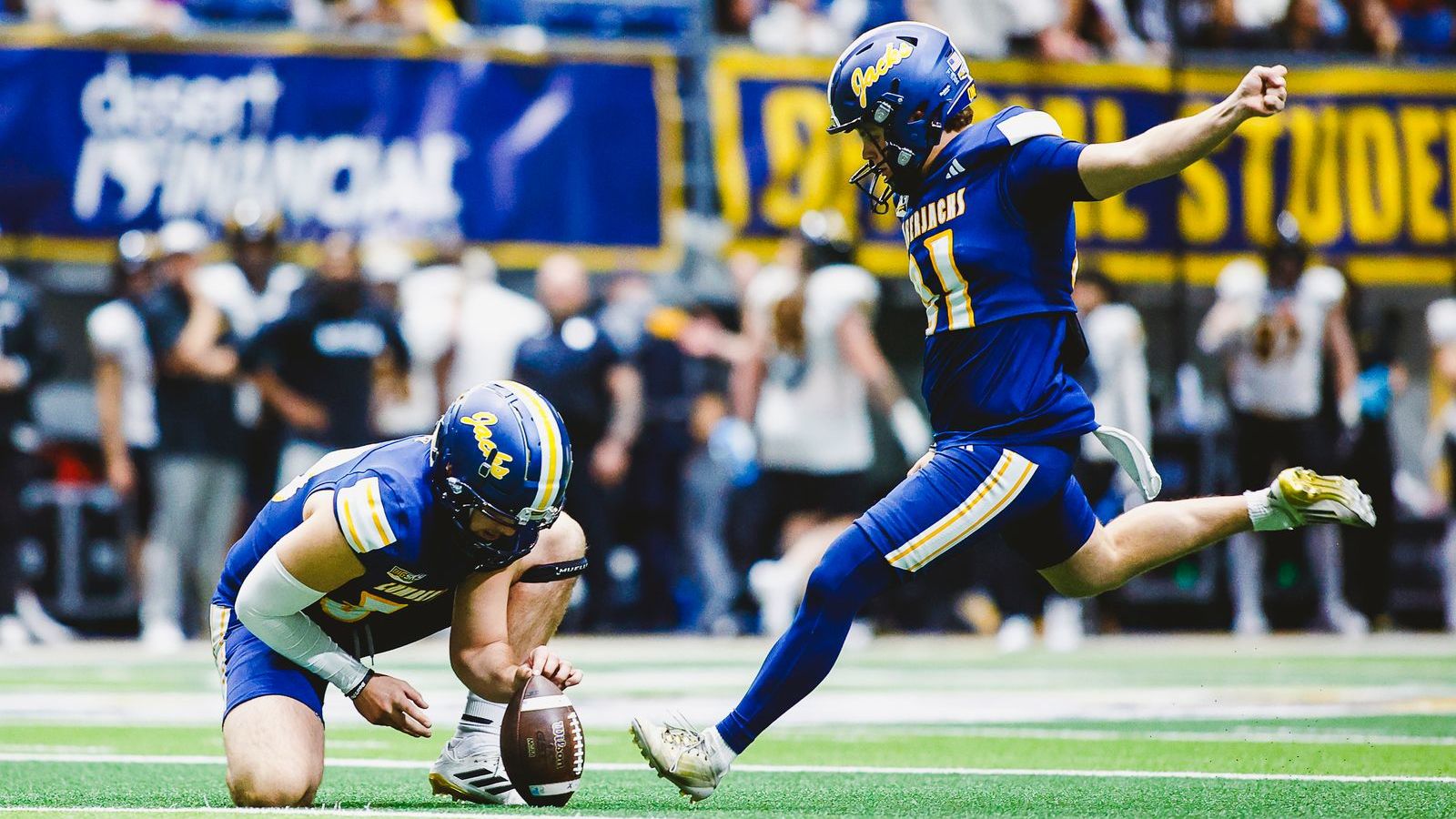 NAU kicker mid-punt.
