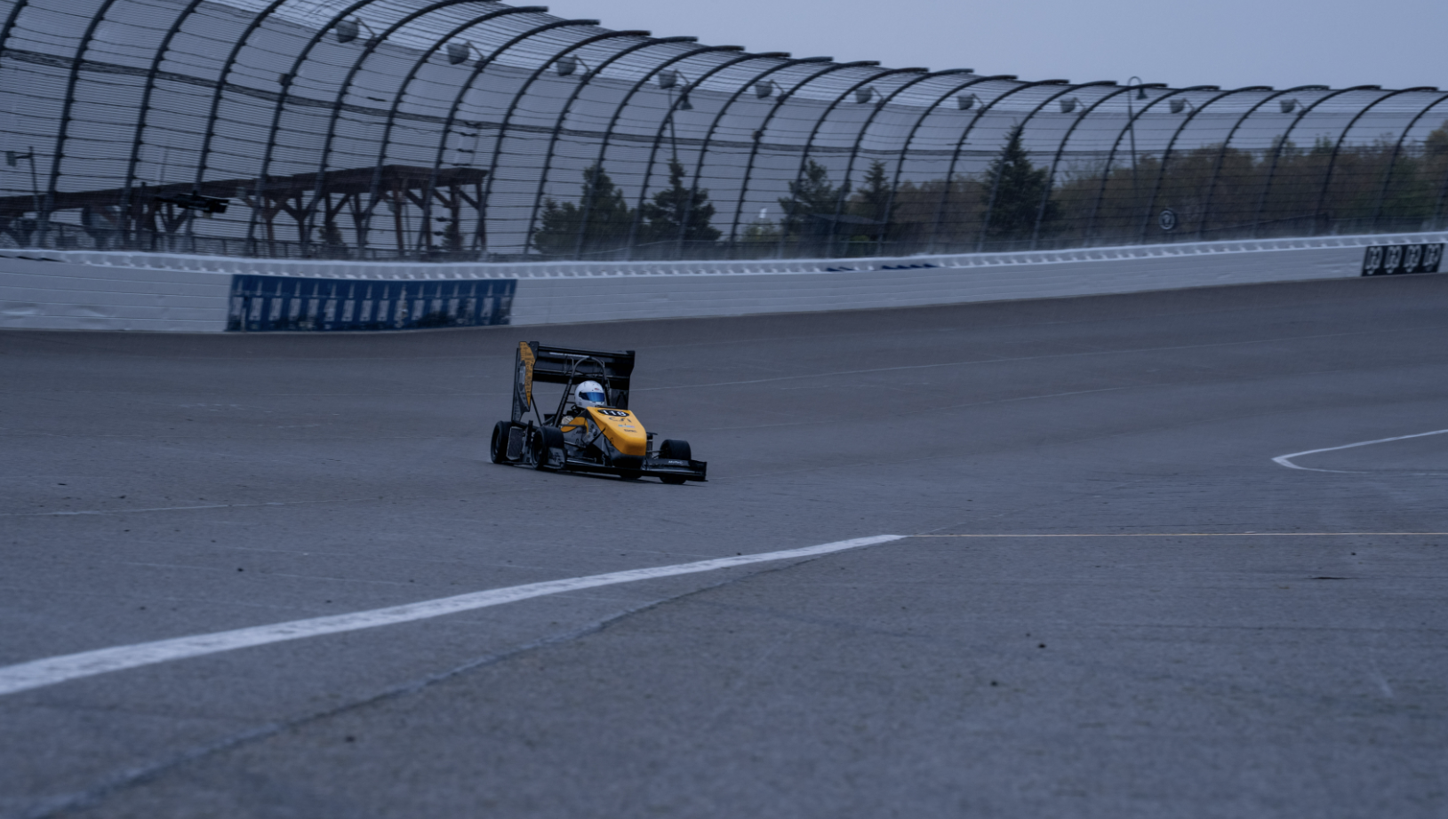 Berkeley Formula Racing’s car racing on the track at Formula SAE Michigan.