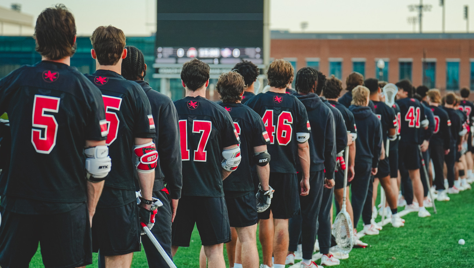 Buckeye lacrosse team in a team huddle before a game