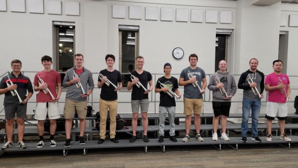 Students holding trumpets