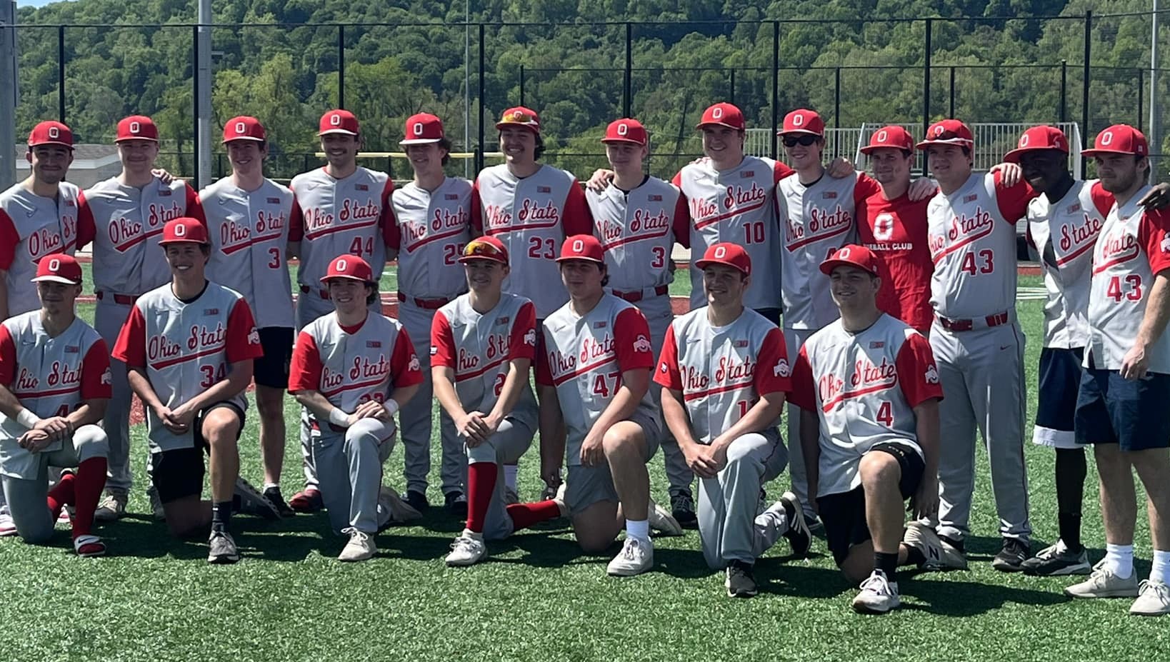 Ohio State baseball club players congratulating each other after a win