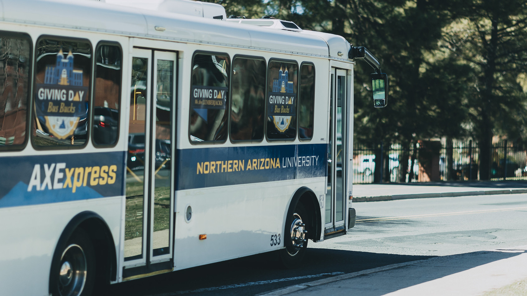 NAU Axe Express Shuttle with Giving Day window stickers