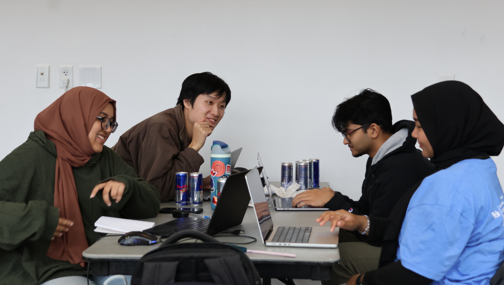 Students working on their projects, powered by Redbull