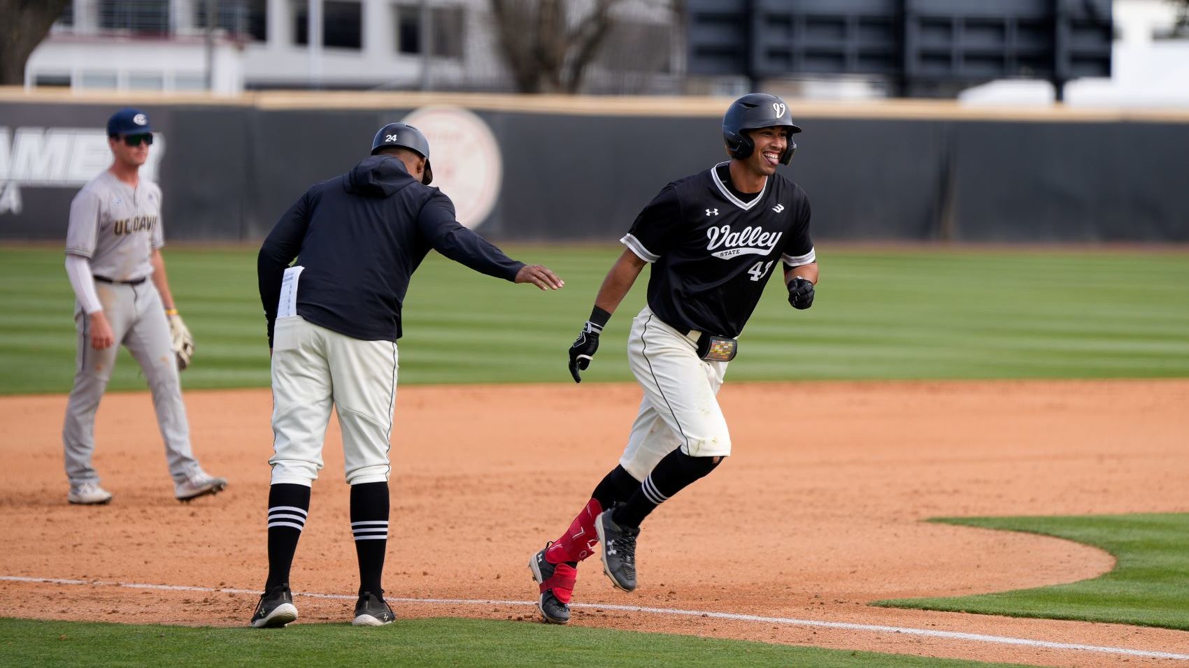 CSUN Baseball player rounding a base