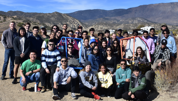 The Bruin Racing Baja team at a drive day with two of their off-road vehicles