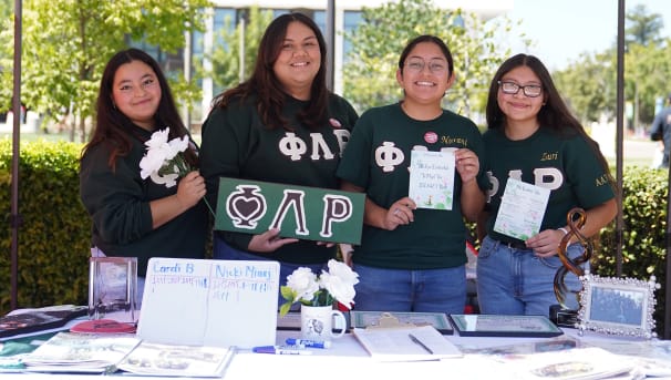 Students tabling for Phi Lambda Rho