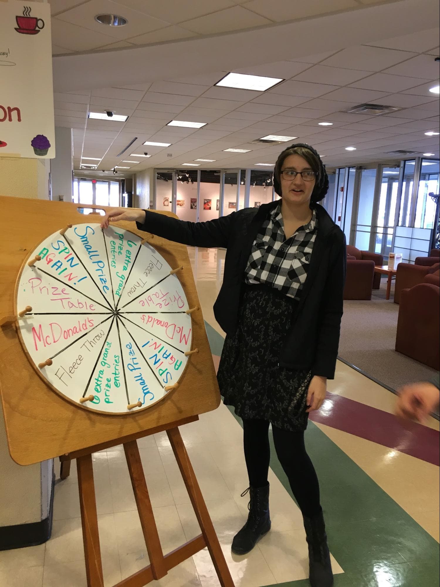 Student explaining spinning prize wheel