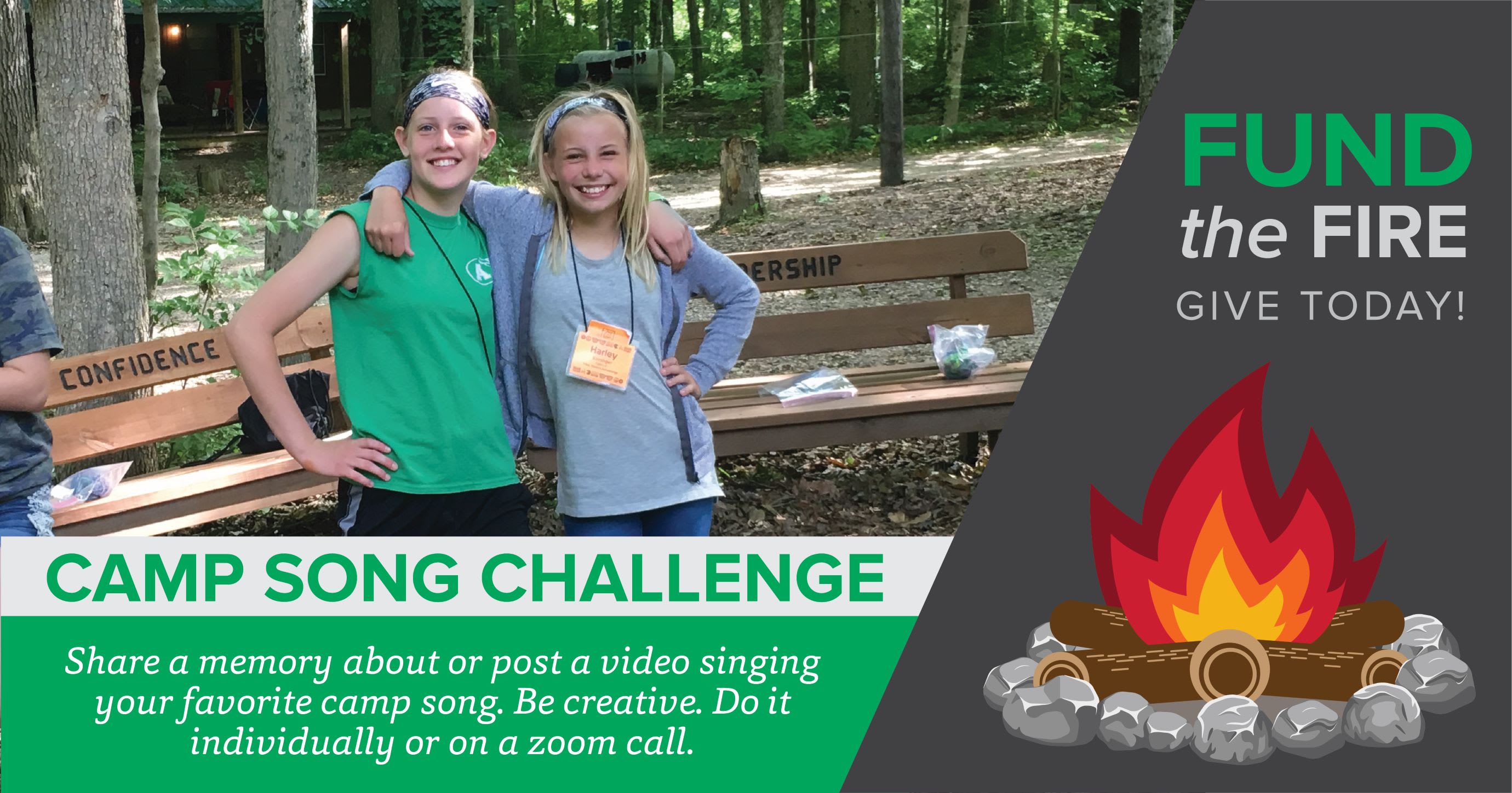 Two campers with the camp song challenge info