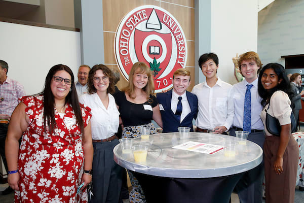 A group around a circular table at the fundraiser