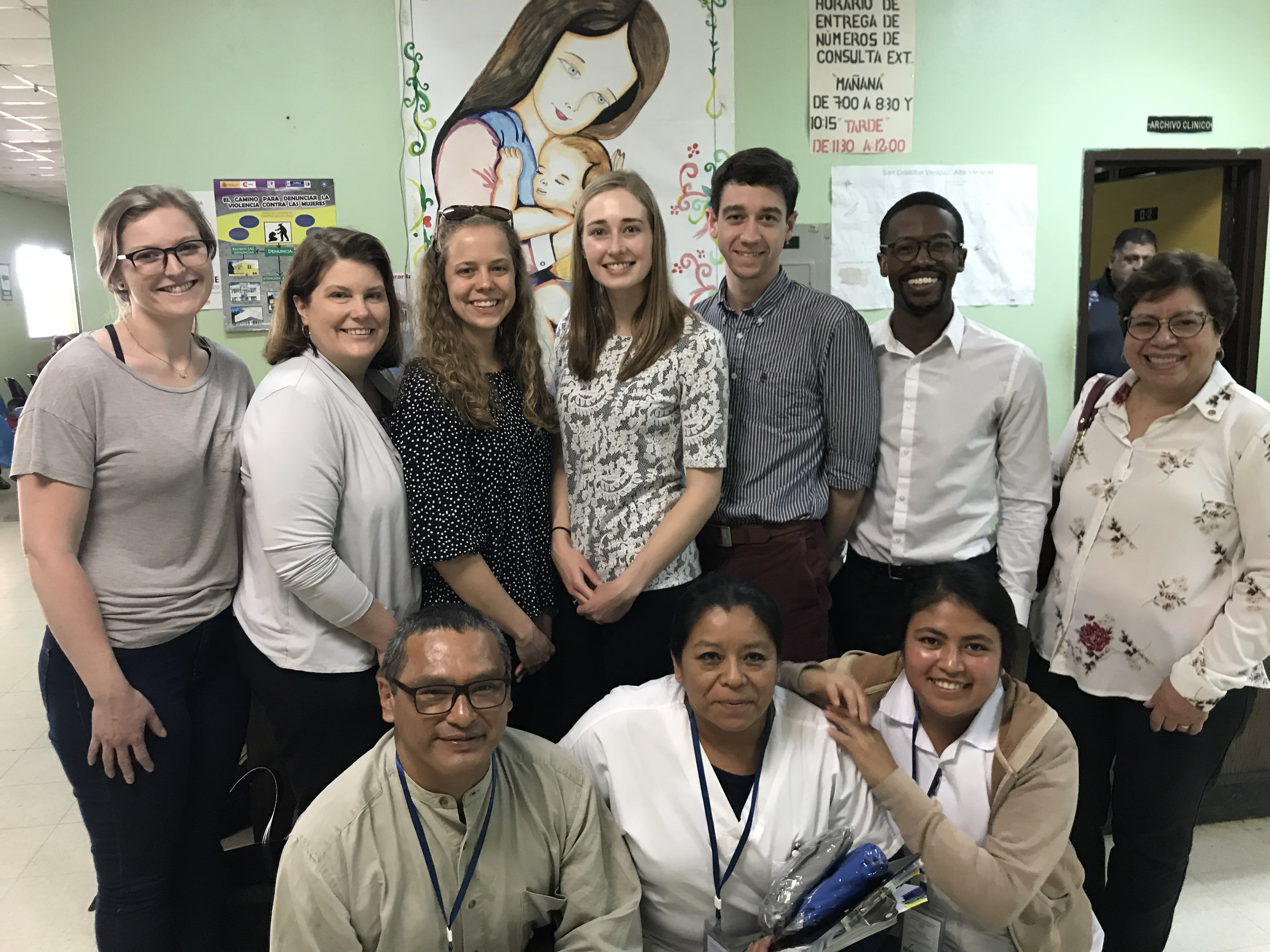 Individuals standing inside a medical building