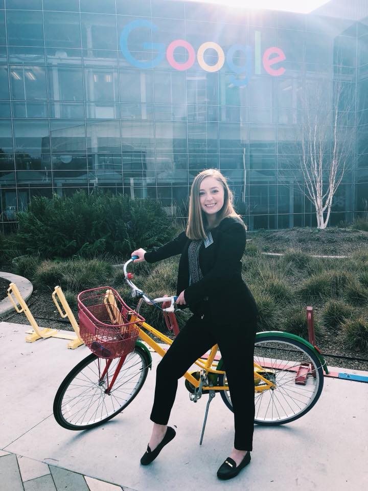 Lauren Holly holds onto yellow bike's handles