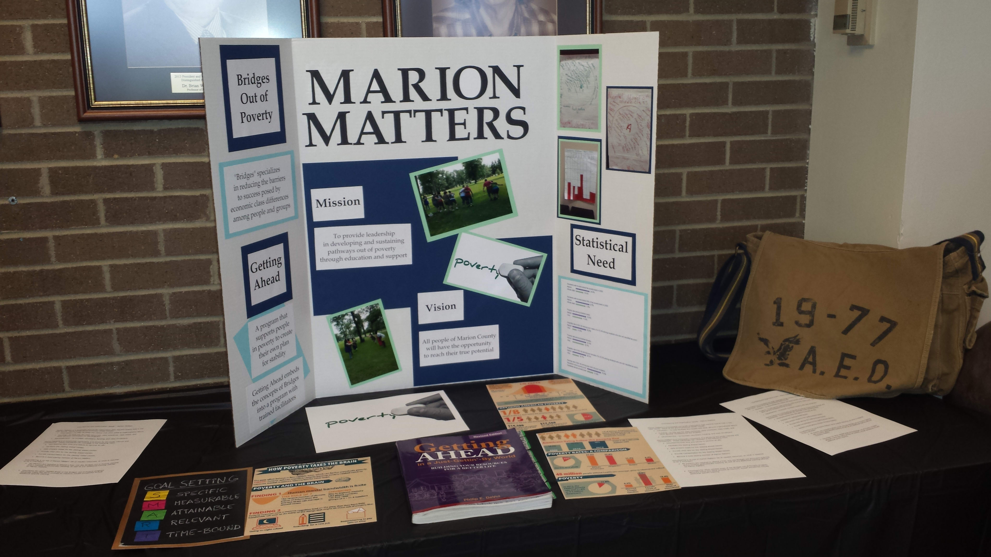 Trifold and papers on table with information