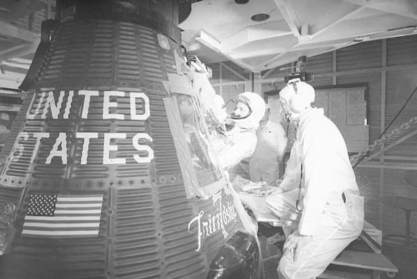 Three astronauts working on a project