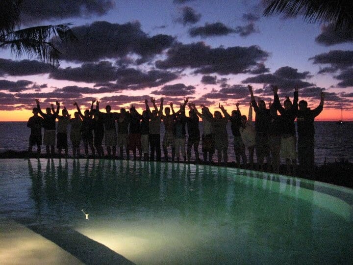 Nancy Lahmers and others stand at edge of pool