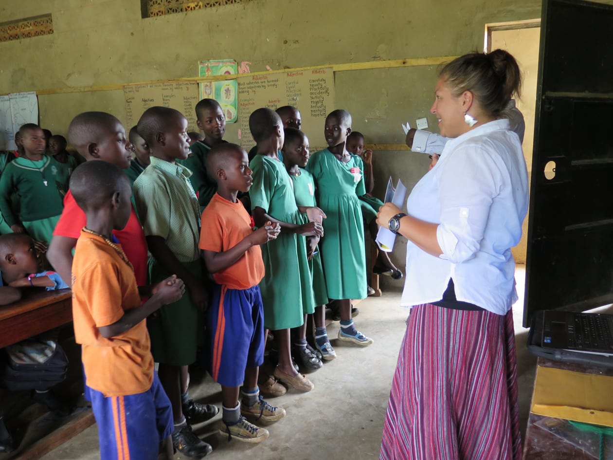Students in Uganda listening to water experts talk