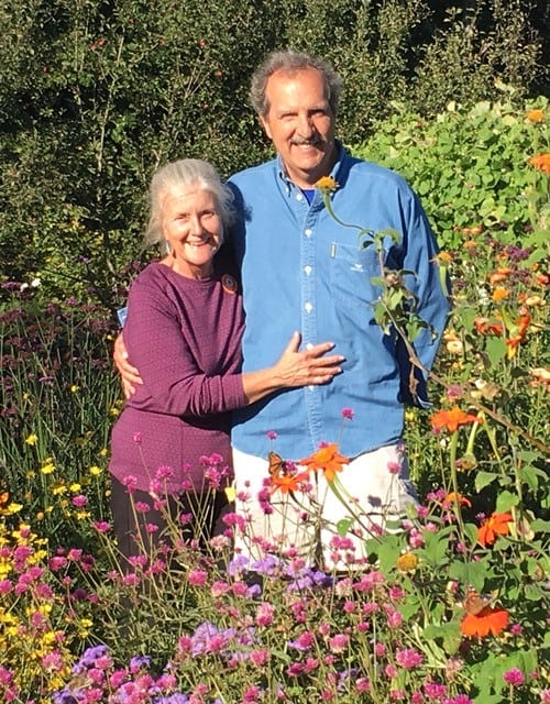 Nancy Lahmers and her husband in a flower field