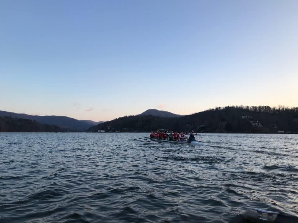A shot of rowers in a big, blue lake