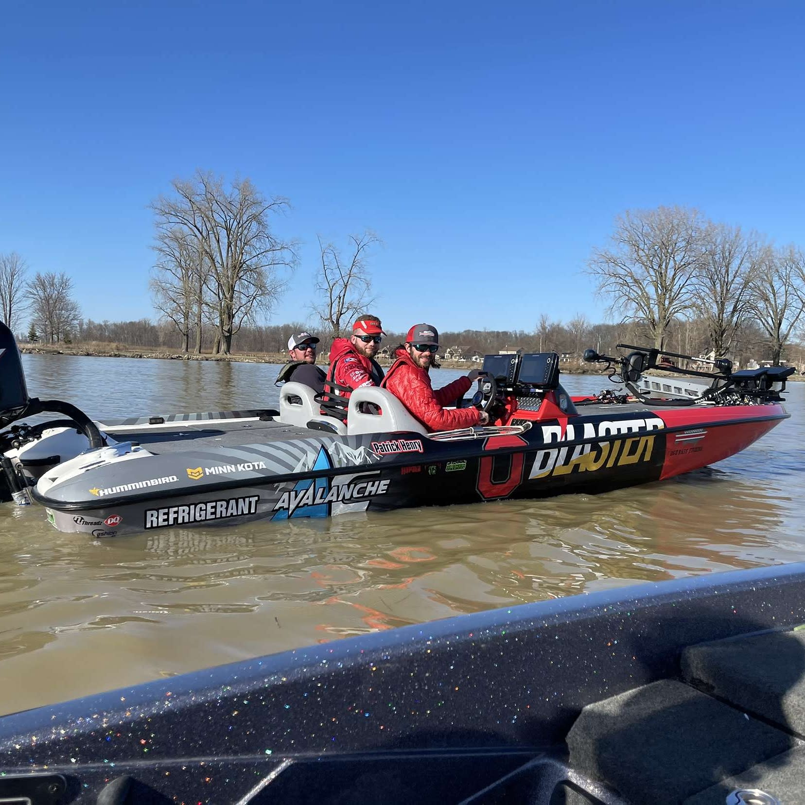 Club members sitting in the Blaster boat