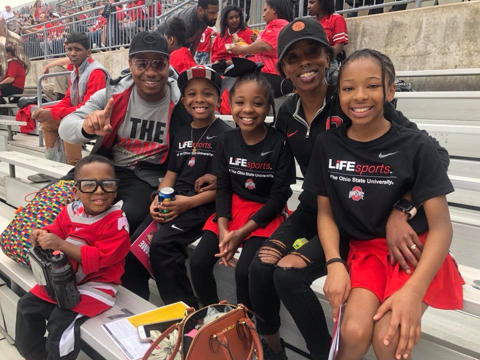 A group of people sitting in OSU's stadium