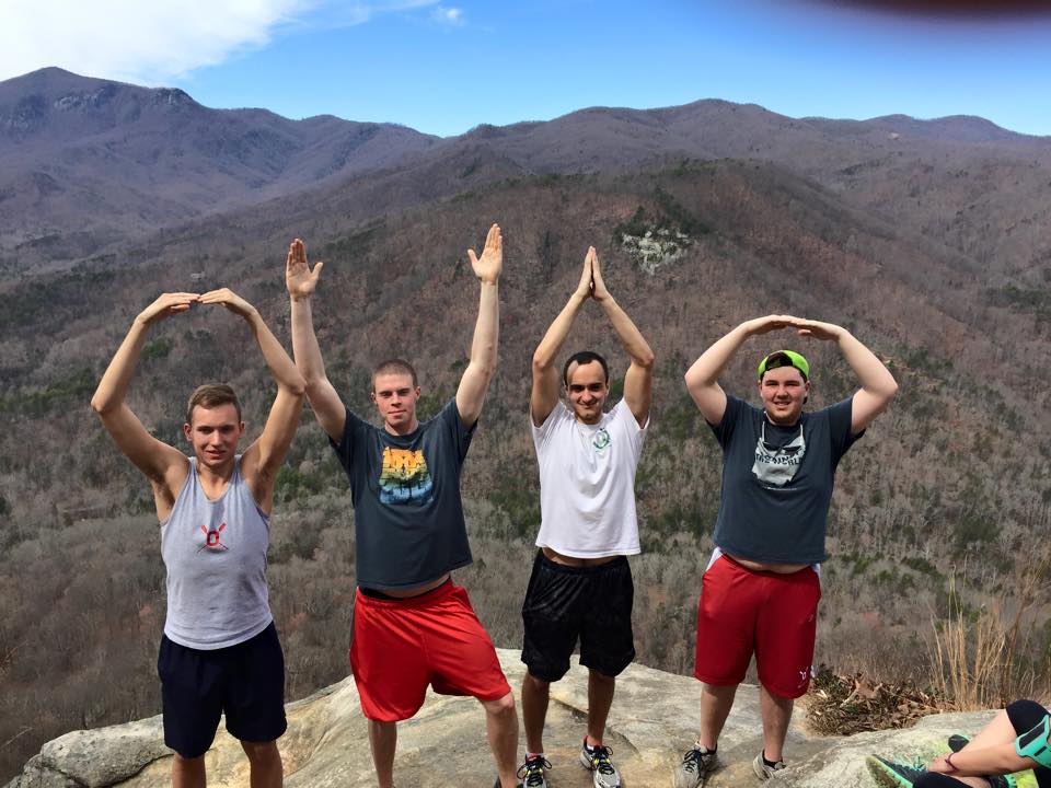 Four ACRA members by a ledge, spelling OHIO