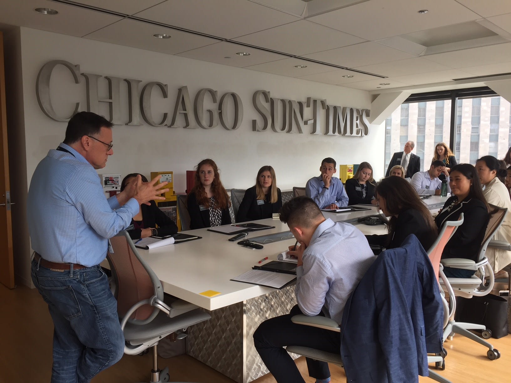 Students listening intently at Chicago Sun-Times