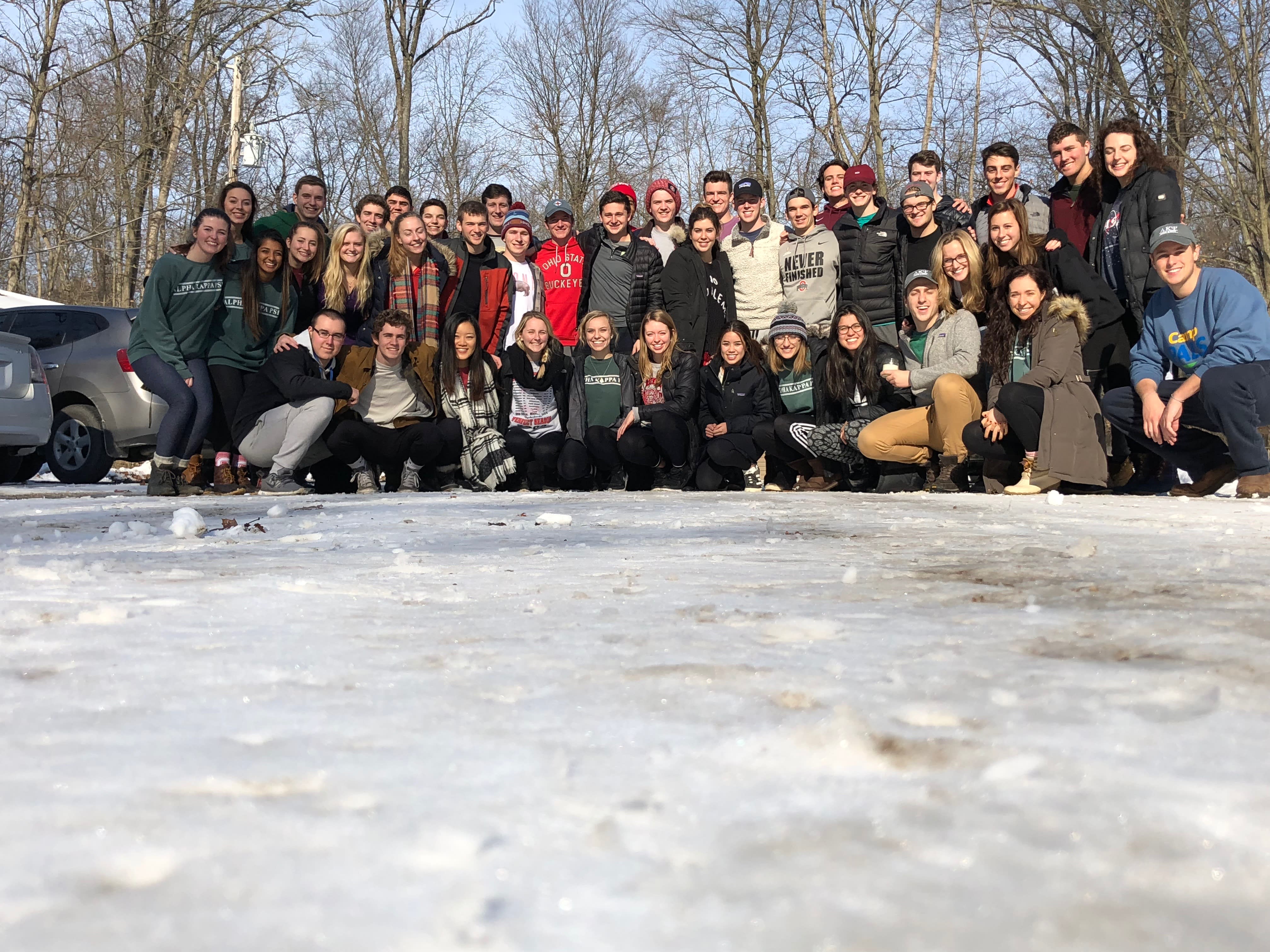 Alpha Kappa Psi members posed in a snowy Ohio