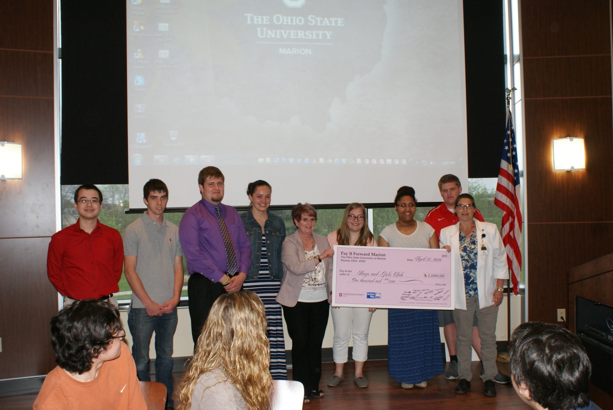Students accepting check for Boys and Girl club