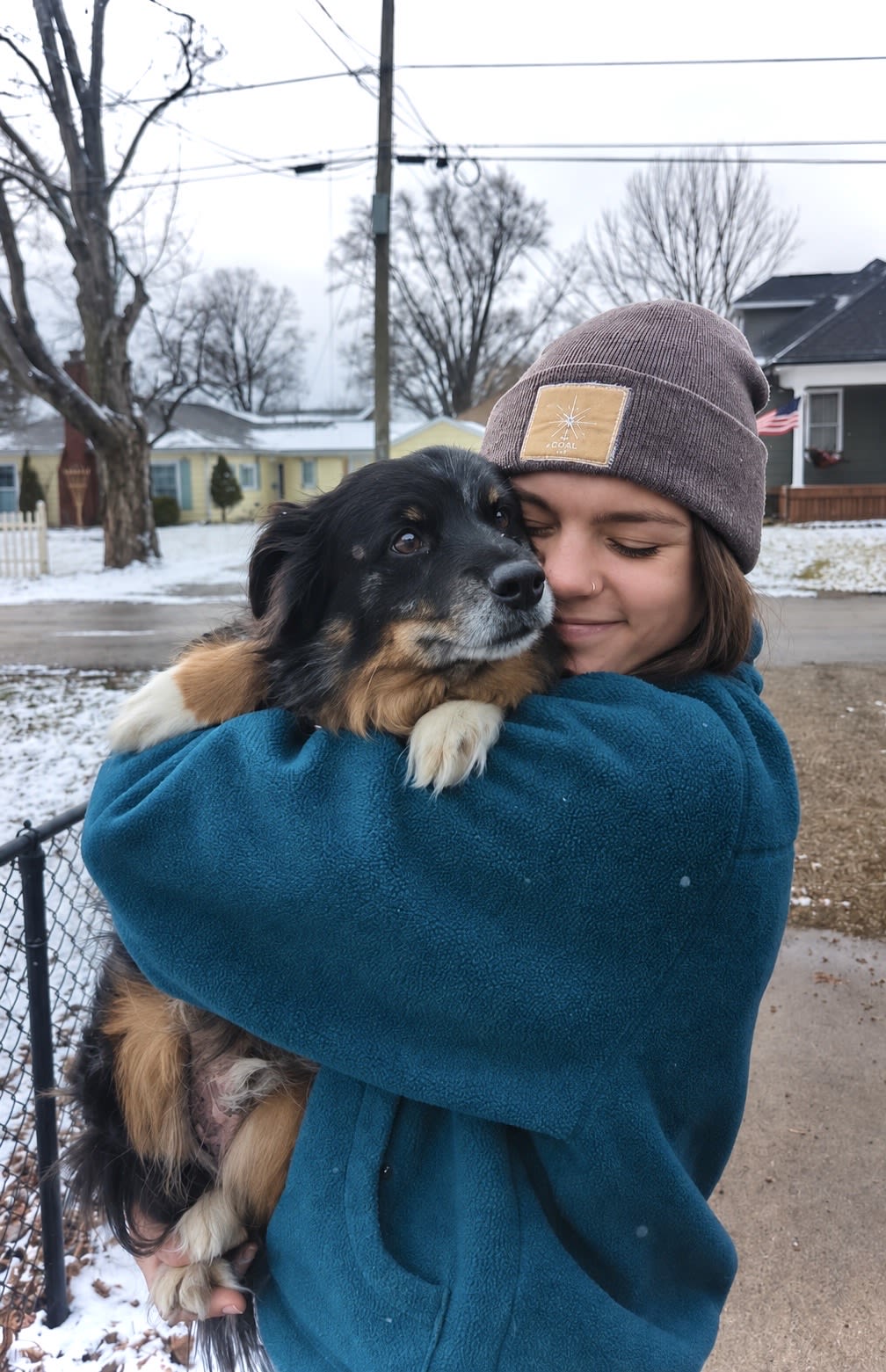 Abby Jensen holding a dog