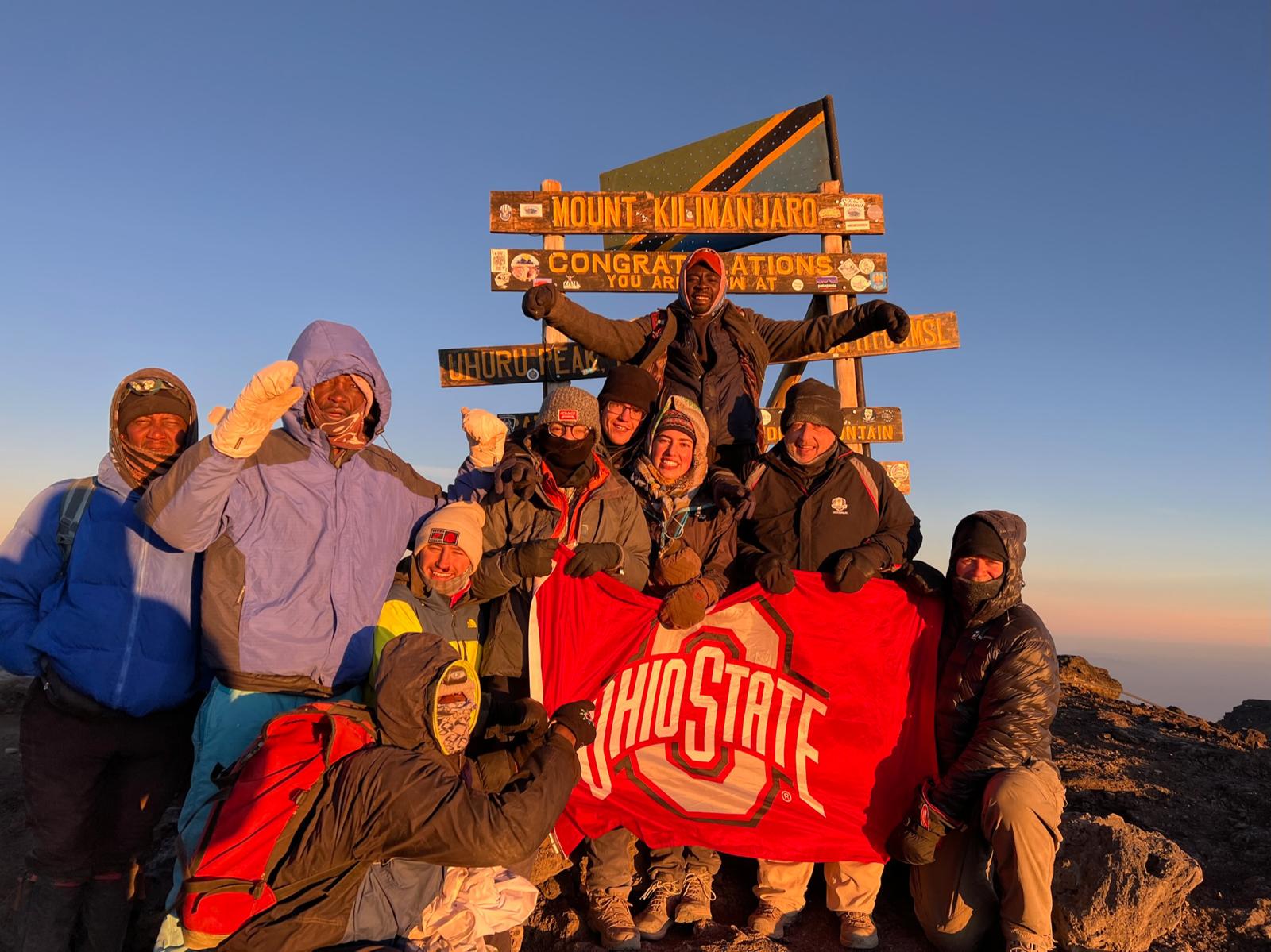 Individuals pose with OSU flag on Kilimanjaro