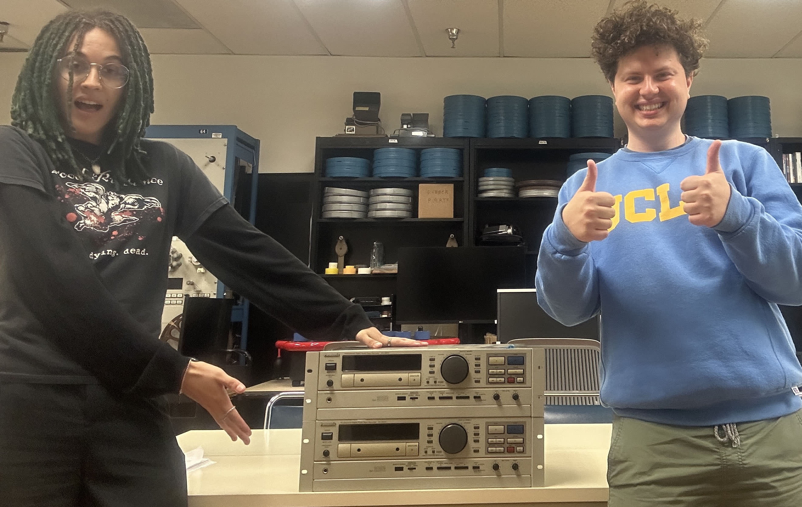 Students pictured in front of donated equipment.
